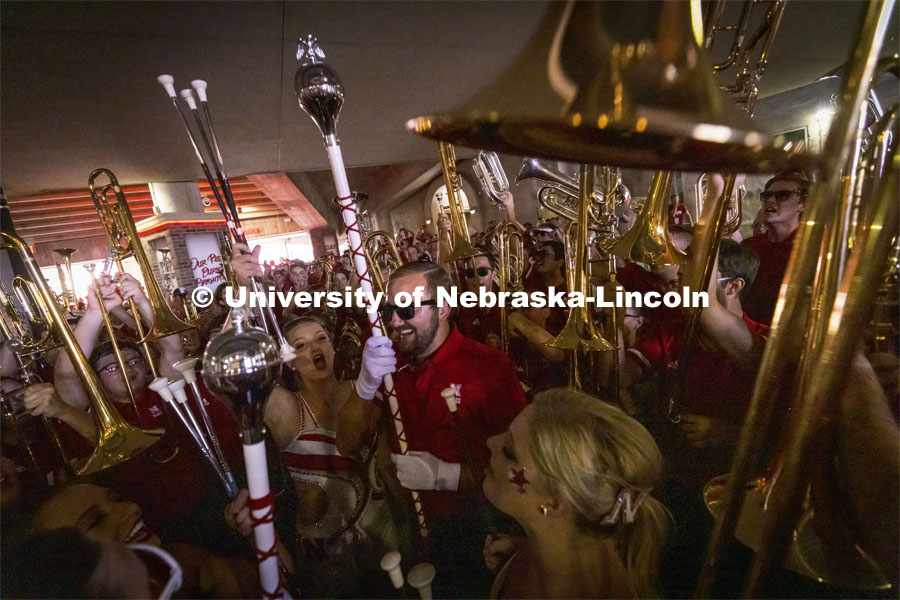 The Cornhusker Marching Band gets revved up to run out on the field before the Nebraska vs. Buffalo University game on the 20th anniversary of 9/11. Photo by Craig Chandler / University Communication.