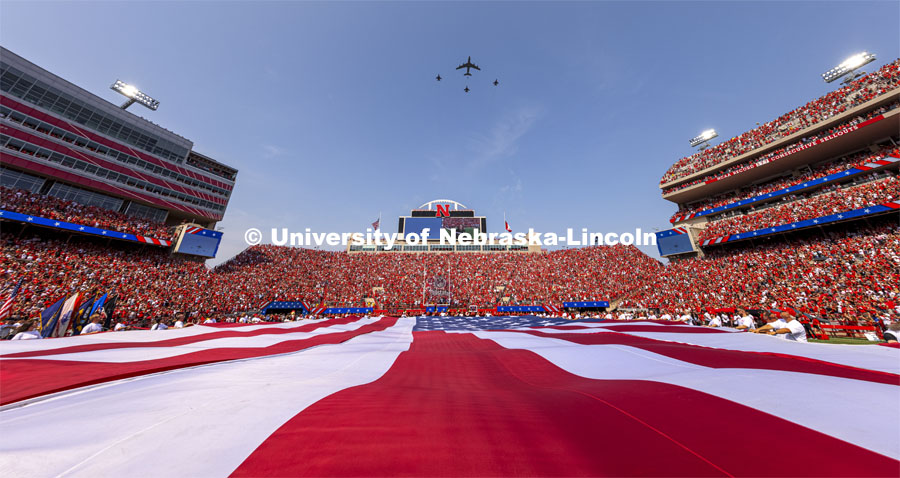 A KC-135 refueling tanker from Lincoln’s Nebraska Air National Guard 155th Air Refueling Wing flied in formation with fighter jets above the stadium. A US flag in the shape of the lower 48 states filled 50 yards of Tom Osborne Field for the national anthem. Nebraska vs. Buffalo University game on the 20th anniversary of 9/11. Photo by Craig Chandler/ University Communication.