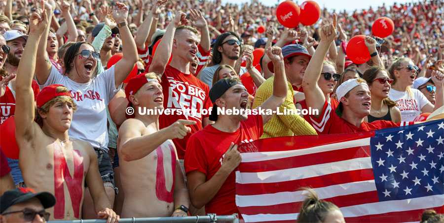 From left, Adam Miller, Gavin Claus, Ethan Jasinski and Easton Albrecht show their Husker and U.S. pride as they cheer the first Husker touchdown. Nebraska vs. Buffalo University game on the 20th anniversary of 9/11. Photo by Craig Chandler / University Communication.