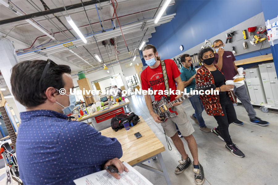 Broderick Fielding, Mechanical Engineering major, shows off an electric guitar that he made in the Maker Space. Nebraska Innovation Studio grand re-opening open house. September 16, 2021. Photo by Craig Chandler / University Communication.