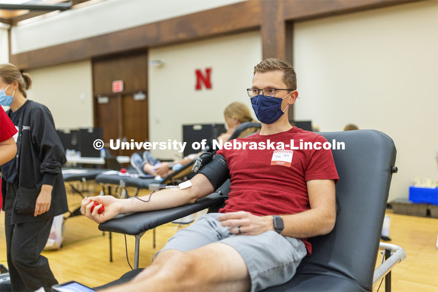 Tim Aulner, a masters student, from Omaha, donates Tuesday. Homecoming week blood drive in Nebraska Union. September 28, 2021. Photo by Craig Chandler / University Communication.