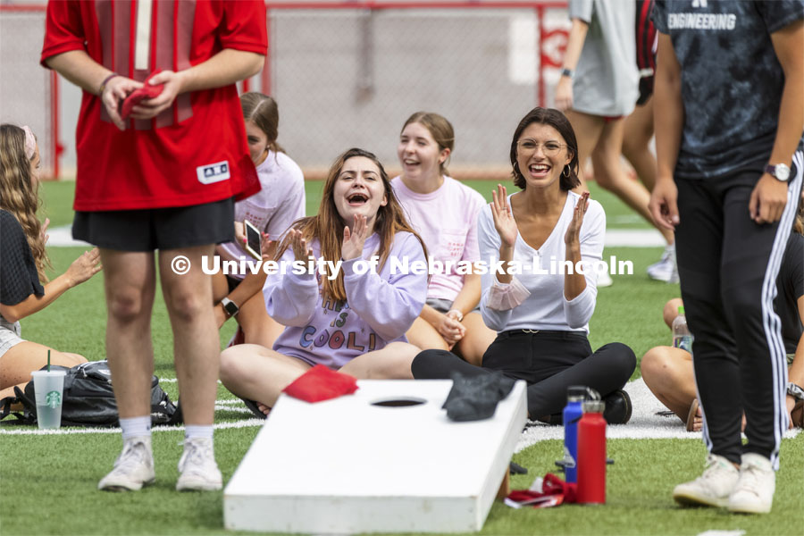 The Mortar Board team brought their own cheering section. Homecoming Cornhole Tournament. Teams of two square off against each other in the classic lawn game of cornhole in Memorial Stadium. September 29, 2021. Photo by Craig Chandler / University Communication.