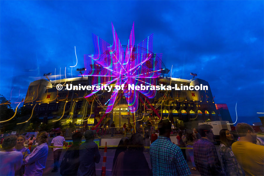 The east side of Memorial Stadium is lit up by the lights of the ferris wheel from the Homecoming Parade and Cornstalk Festival. Homecoming Parade and Cornstalk Festival. October 1, 2021. Photo by Craig Chandler / University Communication.