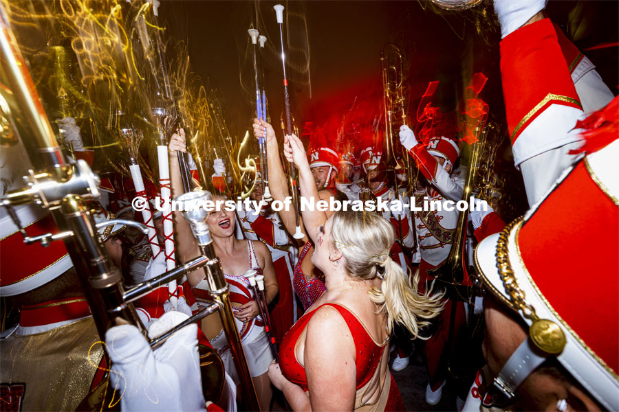The Cornhusker Marching Band gets revved up to run out on the field before the Nebraska vs Northwestern University homecoming game. October 2, 2021. Photo by Craig Chandler / University Communication.