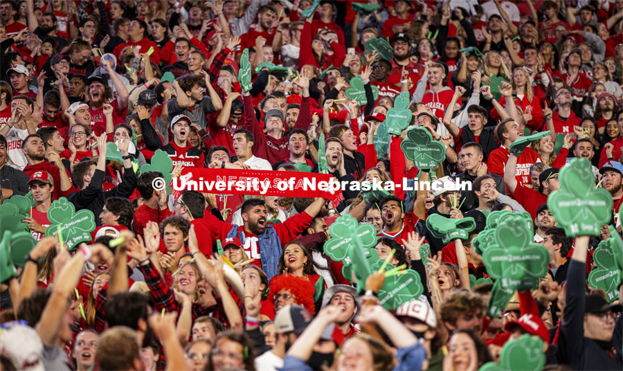 The student section wave foam shamrocks to help promote the 2022 Nebraska vs Northwestern University game that is to be played in Ireland.  October 2, 2021. Photo by Craig Chandler / University Communication.