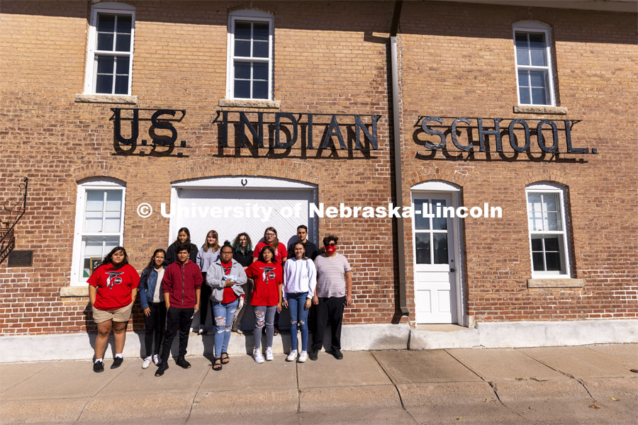 Students from the UNITE tour group pose in front of the Genoa Indian School. Students from UNITE tour the Genoa Indian School in Genoa, Nebraska. October 10, 2021. Photo by Craig Chandler / University Communication.