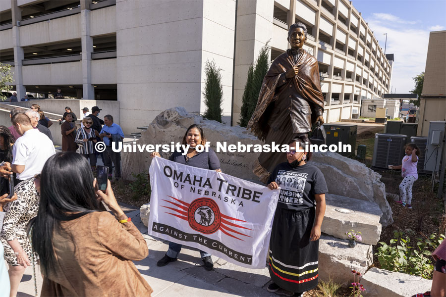 Members of the Omaha Tribe pose for photos with the sculpture of Dr. Susan LaFlesche Picotte, the first Indigenous person to receive a medical degree. Dedication ceremony of a sculpture of Dr. Susan LaFlesche Picotte, the first Indigenous person to receive a medical degree was held at Heritage Plaza on Centennial Mall. Dr. LaFlesche Picotte was a member of the Omaha tribe. The sculpture dedication was part of the State’s day-long celebration of Nebraska’s first Indigenous Peoples Day. October 11, 2021. Photo by Craig Chandler / University Communication.