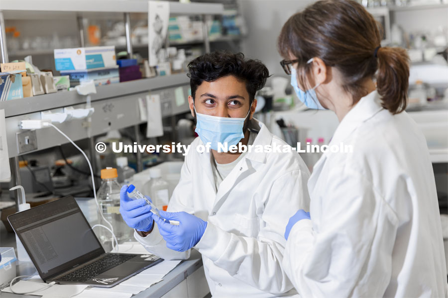 Abdullah Al Mukhaini, junior in forensic science, and lab manager Sandra Thibivilliers discuss his samples in Marc Libault’s lab in Beadle Hall. October 15, 2021. Photo by Craig Chandler / University Communication.