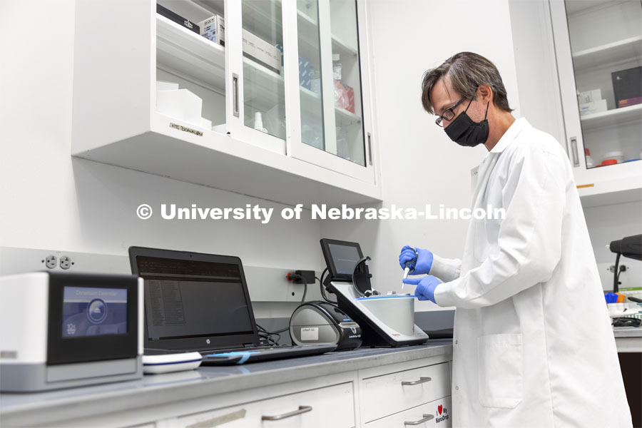 Marc Libault works in his lab in Beadle Hall. October 15, 2021. Photo by Craig Chandler / University Communication.