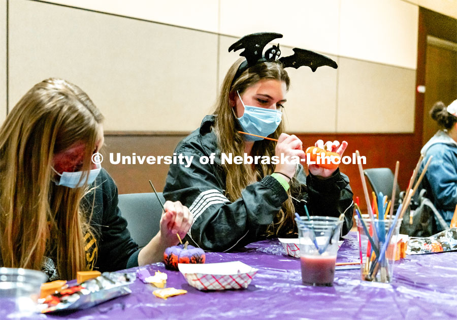 Students at Nightmare at East Campus. Students enjoy a fun-tastic night of indoor Halloween-themed activities and treats in the Nebraska East Union. Students wore costumes to participate in a costume contest, laser tag, pumpkin painting, bowling and a hayrack ride. October 28, 2021. Photo by Jonah Tran / University Communication. 