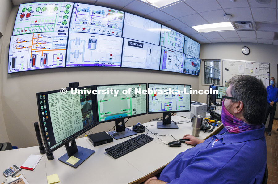 Cody Kinning, an operator with utility services, monitors the city campus power plant using the screens in the control room. City Campus utility plant. November 17, 2021. Photo by Craig Chandler / University Communication.