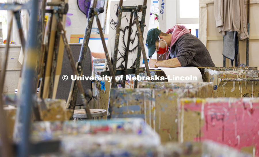 Javier Rivera, a senior from Omaha, works on his project in Aaron Holz’ Intermediate Painting class in Richards Hall. December 1, 2021. Photo by Craig Chandler / University Communication.