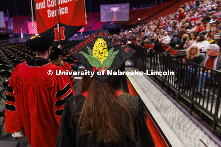 Sarah Burke decorated her mortar board for a corny look. Undergraduate Commencement at Pinnacle Bank Arena. December 18, 2021. Photo by Craig Chandler / University Communication.