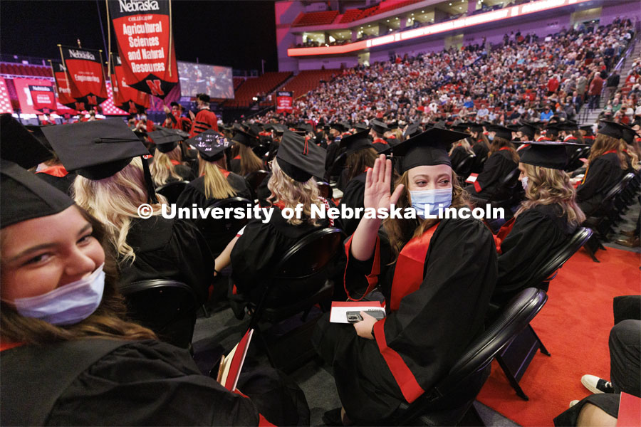 Emma Troshynski waves to her family and friends in the arena. Emily is a Animal Science and pre-vet graduate. Undergraduate Commencement at Pinnacle Bank Arena. December 18, 2021. Photo by Craig Chandler / University Communication.