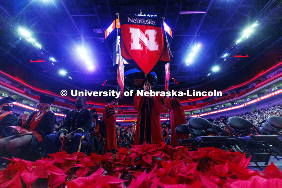 The Nebraska gonfalon leads the stage party into the arena. Undergraduate Commencement at Pinnacle Bank Arena. December 18, 2021. Photo by Craig Chandler / University Communication.
