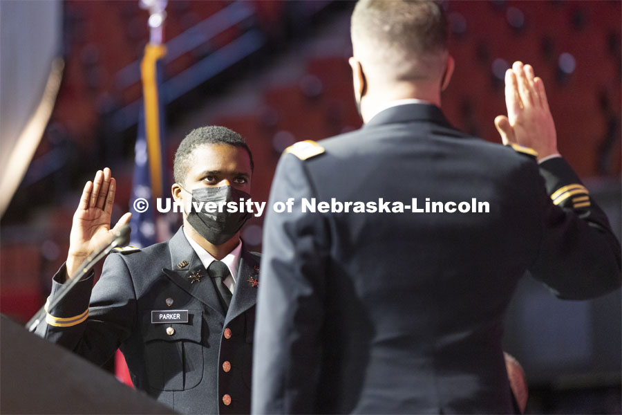 Hunter Parker takes oath of office as he was commissioned as a second lieutenant in the U. S. Army from Colonel Thad Fineran of Nebraska National Guard during commencement. Undergraduate Commencement at Pinnacle Bank Arena. December 18, 2021. Photo by Craig Chandler / University Communication.