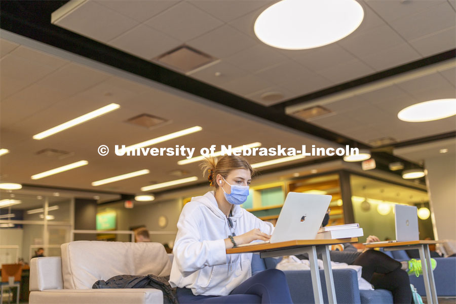 Carlie Cahoy of Norfolk studies in Love Library on the first day of classes for the spring semester. January 18, 2022. Photo by Craig Chandler / University Communication.