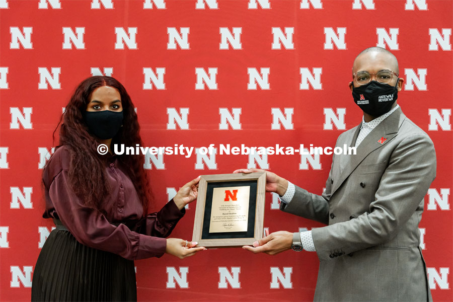 Batool Ibrahim, Fulfilling the Dream award winner poses with her award and Marco Barker, Vice Chancellor of Diversity and Inclusion. MLK Commemorative Celebration 2022. January 19, 2022. Photo by Jonah Tran / University Communication.