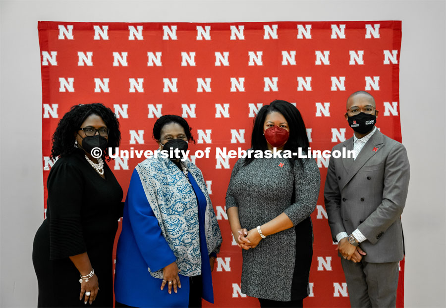 Charlie Foster, Gwen Combs, Nkenge Friday, and Marco Barker, part of the Office of Diversity and Inclusion, pose in front of the Nebraska N backdrop at the MLK Commemorative Celebration 2022. January 19, 2022. Photo by Jonah Tran / University Communication.