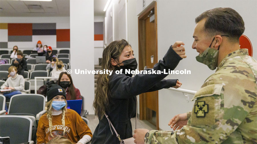 Spc. Allen Castaneda surprises his sister, Priscila, at the end of her criminal justice class. Castaneda returned early from his deployment with the Army Reserves. January 27, 2022. Photo by Craig Chandler / University Communication.