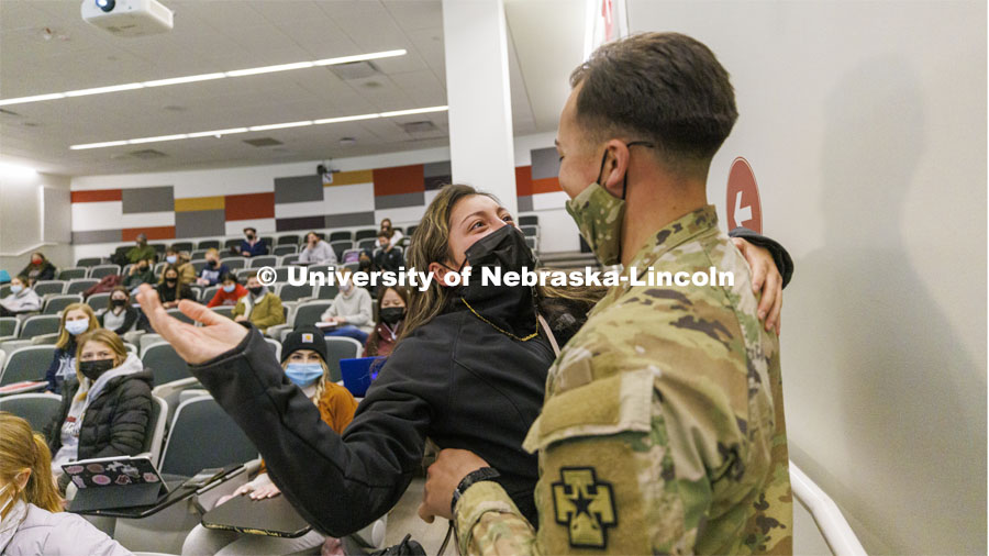 Spc. Allen Castaneda surprises his sister, Priscila, at the end of her criminal justice class. Castaneda returned early from his deployment with the Army Reserves. January 27, 2022. Photo by Craig Chandler / University Communication.