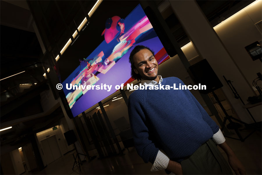 Ebben Blake is an immersive storyteller in the Johnny Carson Center for Emerging Media Arts. A Nebraska Foundation scholarship is helping to attain Ebben’s goals. Ebben is standing in front of a virtual story telling concept they designed for the Lincoln Children’s Museum. February 1, 2022. Photo by Craig Chandler / University Communication.