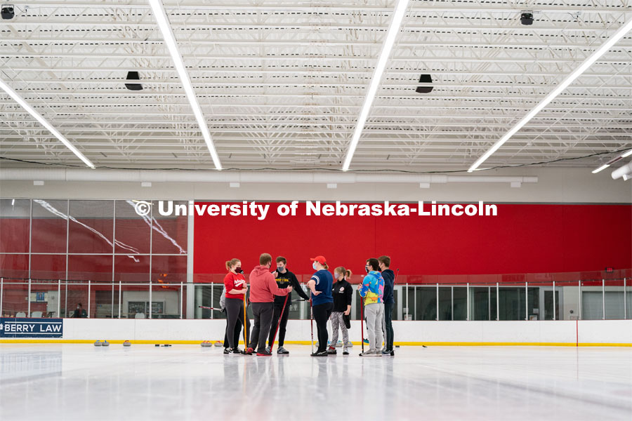 The University of Nebraska Curling Club speak to each other during practice at the John Breslow Ice Hockey Center. Curling Club. February 1, 2022. Photo by Jordan Opp for University Communication.