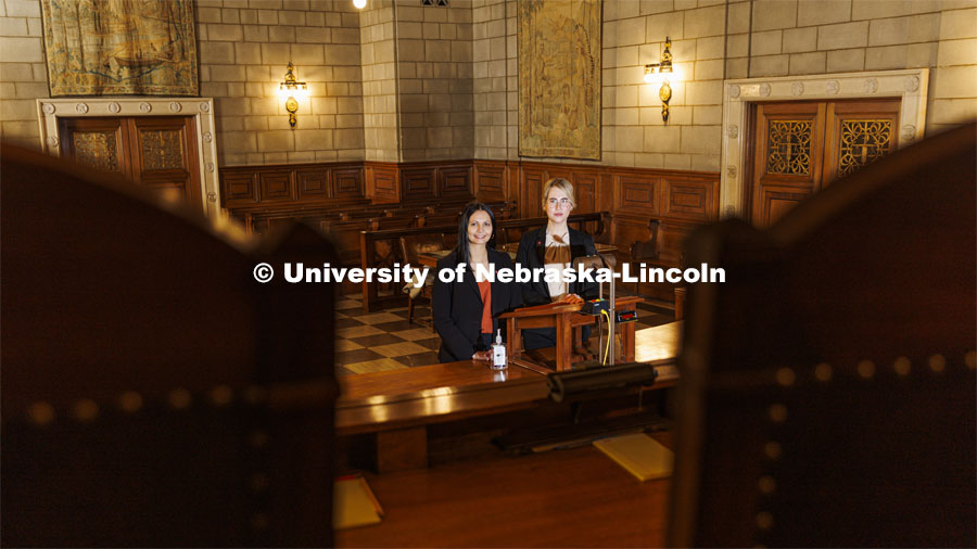 Nebraska Law students Jayden Barth (left) and Rachel Tomlinson Dick delivered oral arguments in the Nebraska Supreme Court. Both are third-year students mentored by Law Professor Ryan Sullivan. They are pictured in the Supreme Court chambers. February 4, 2022. Photo by Craig Chandler / University Communication.