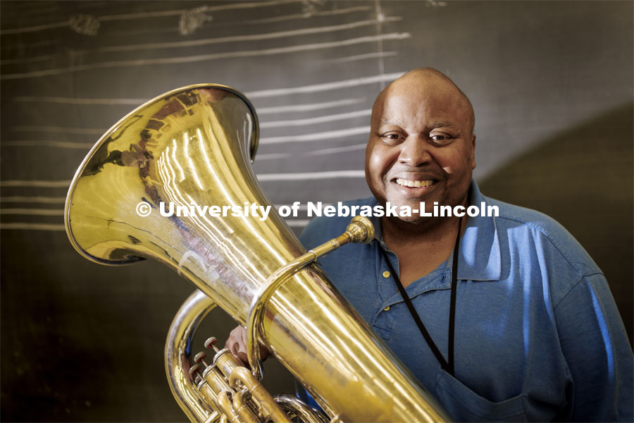 Kabin Thomas is a non-traditional doctoral student in music, specifically tuba performance. He’s able to pursue his doctorate through a fellowship that receives support from Glow Big Red. Thomas is photographed with his tuba in the Glenn Korff School of Music. February 7, 2022. Photo by Craig Chandler / University Communication.