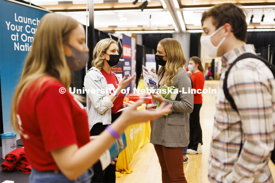 Recruiter Cassidy Starostka and Claire Fletcher talk at the Omaha National Insurance booth at the UNL Spring Career Fair in the Nebraska Union. February 14, 2022. Photo by Craig Chandler / University Communication.
