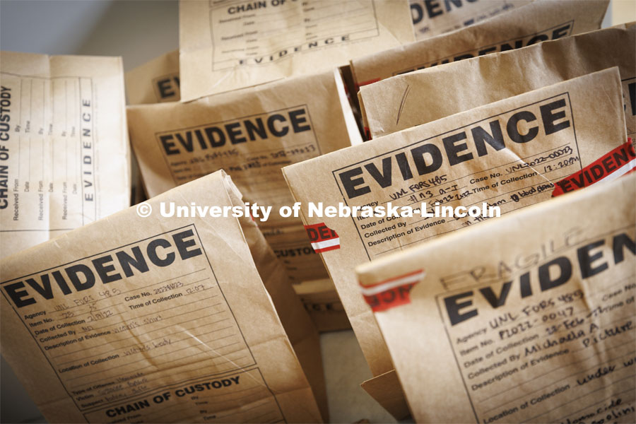 Evidence bags are collected and labeled by students. Students do crime scene investigation in the murder house. Forensic Science “Murder House” is a small derelict house on the north side of East Campus that has been rebuilt and made accessible for students to use as a location forensic lab. February 17, 2022. Photo by Craig Chandler / University Communication.
