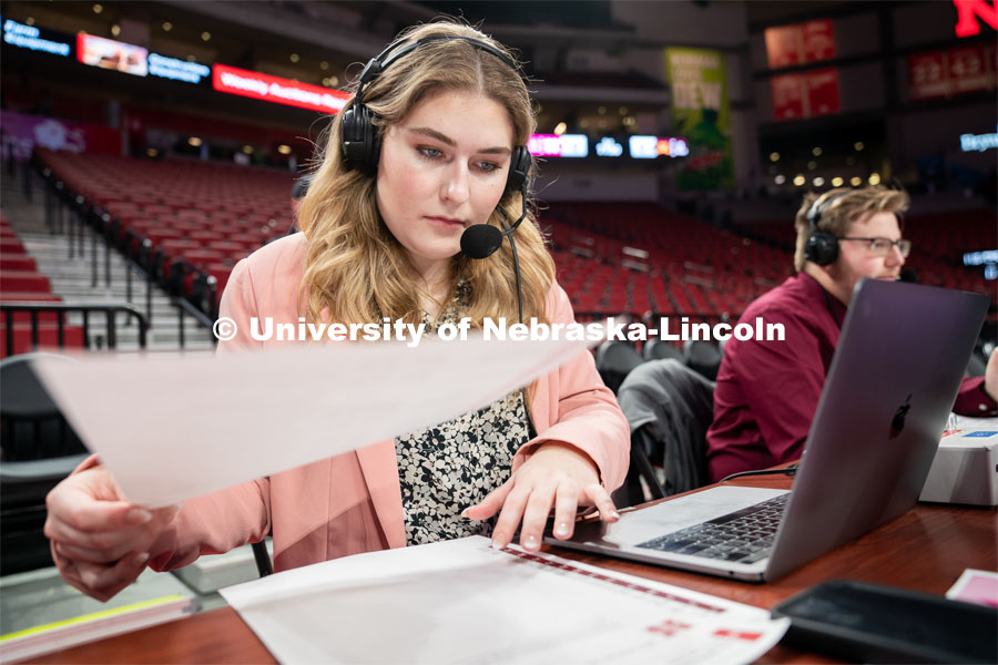 Hailey Ryerson organizes her notes before the Huskers’ Women’s Basketball match against Minnesota at Pinnacle Bank Arena. February 20, 2022. Photo by Jordan Opp / University Communication.