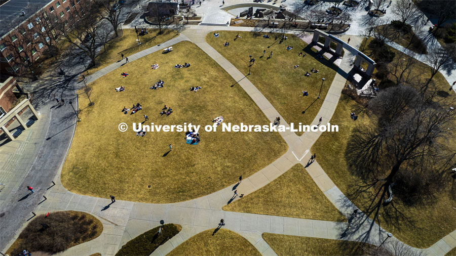 Aerial view of the City Campus green space filled with students laying out and soaking up some sun on the first warm days of March. March 2, 2022. Photo by Craig Chandler / University Communication.