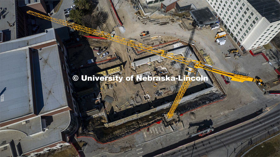 A construction crane fills the sky as work progresses on Kiewit Hall. March 2, 2022. Photo by Craig Chandler / University Communication. 