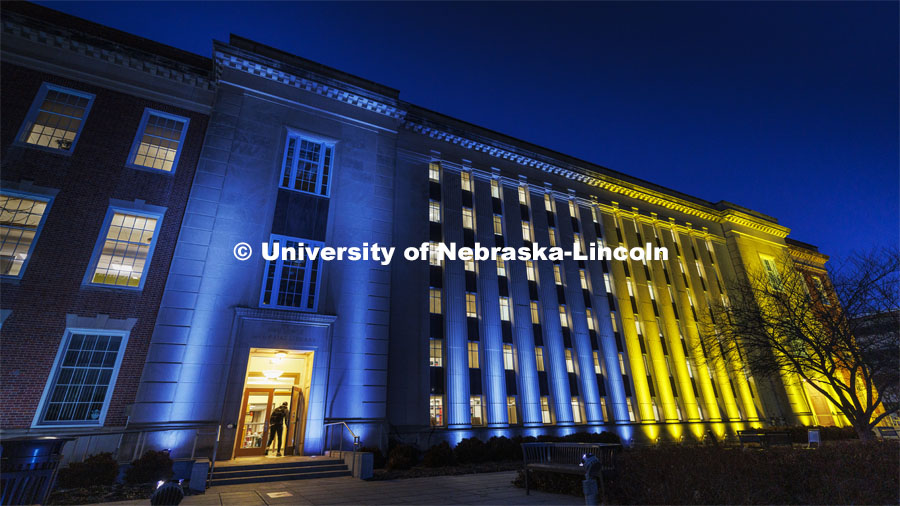 Love Library on the Nebraska’s City Campus is bathed in blue and yellow lights to show the world our hearts go out to our Husker family at home and abroad who are affected by the ongoing crisis in Ukraine. March 7, 2022. Photo by Craig Chandler / University Communication.