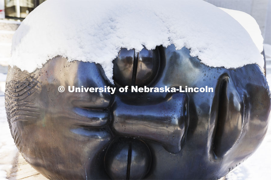 The Fallen Dreamer sculpture is covered with snow. Huskers woke up Monday morning to an inch of snow. March 7, 2022. Photo by Craig Chandler / University Communication.