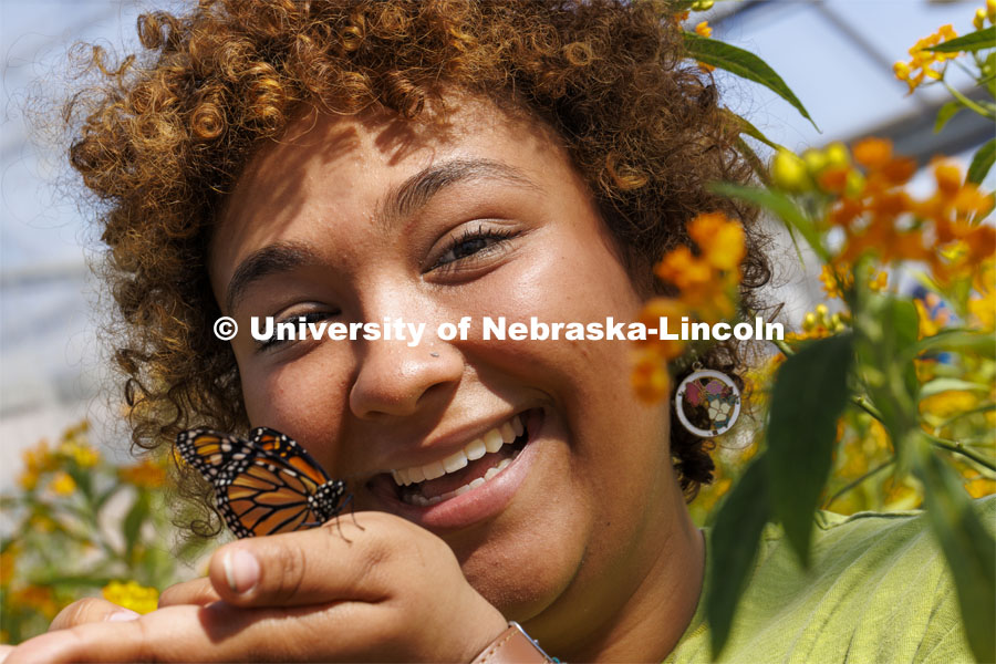 A Monarch butterfly rests on Miyauna Incarnato’s hand. Incarnato is a graduate student in Entomology studying Monarch butterflies. March 8, 2022. Photo by Craig Chandler / University Communication.