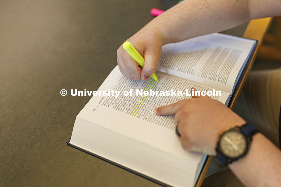 Highlighting in a book. Students studying in the law library. Nebraska Law Photo shoot. March 21, 2022. Photo by Craig Chandler / University Communication.
