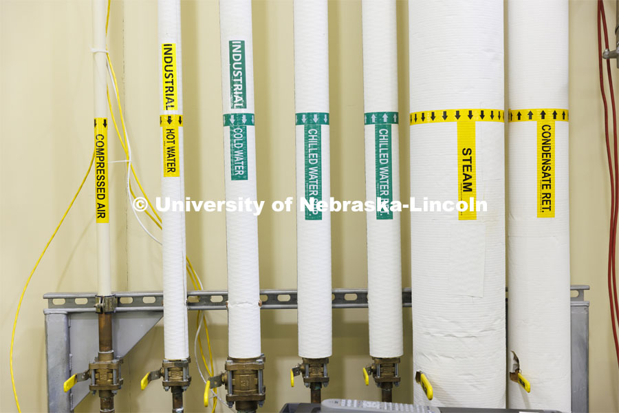 Labeled piping in Hunter Flodman’s UO Lab. College of Engineering photo shoot. March 22, 2022. Photo by Craig Chandler / University Communication.