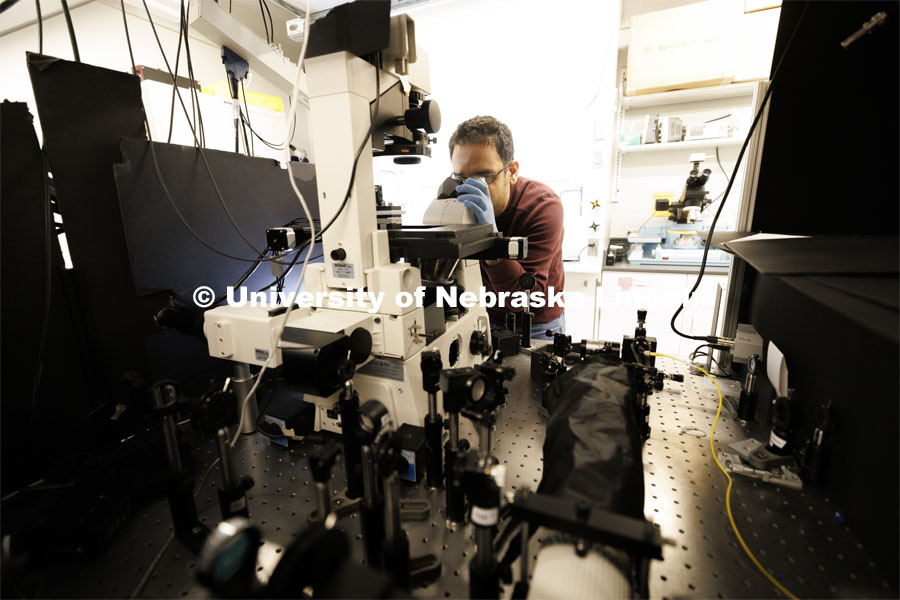 Mohammadjavad Dowran works with diamond quantum sensing microscopes in Abdelghani Laraoui’s lab. College of Engineering photo shoot. March 22, 2022. Photo by Craig Chandler / University Communication.