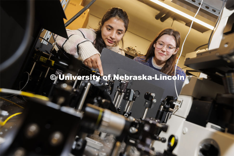 Suvechhya Lamichhane and Isabelle Koehler work with a diamond quantum sensing microscope in Abdelghani Laraoui’s lab. College of Engineering photo shoot. March 22, 2022. Photo by Craig Chandler / University Communication.