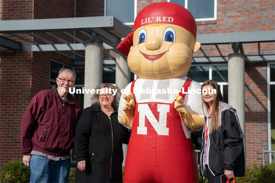 Students pose with Lil’ Red near the Van Brunt Visitor’s Center. Admitted Student Day is UNL’s in-person, on-campus event for all admitted students. March 26, 2022. Photo by Jordan Opp for University Communication.