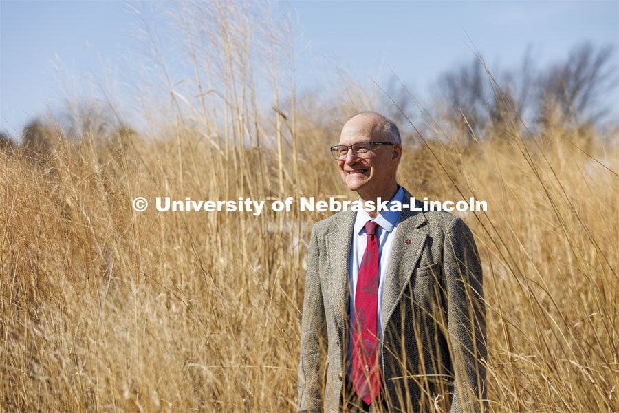 Robert Brooke, Professor of English,  is a 2022 OTICA winner His main teaching work has been in place-conscious education, so he was photographed in an outside space that might replicate Nebraska rurality. April 4, 2022. Photo by Craig Chandler / University Communication.