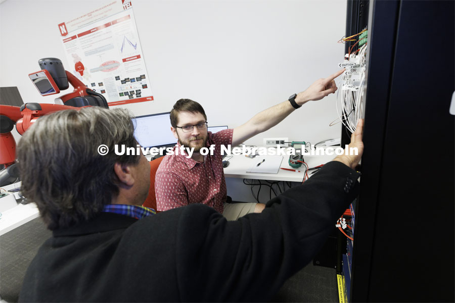 Matthew Boeding and Hamid Sherif discuss a project in Hamid Sherif’s Telecom lab. College of Engineering photo shoot at Peter Kiewit Institute in Omaha. April 5, 2022. Photo by Craig Chandler / University Communication.