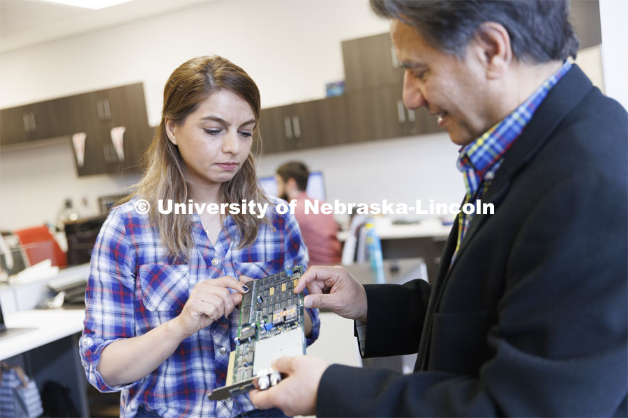 Kimia Ameri and Hamid Sherif work with a circuit board in Hamid Sherif’s lab. College of Engineering photo shoot at Peter Kiewit Institute in Omaha. April 5, 2022. Photo by Craig Chandler / University Communication.