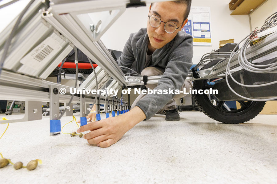 Shengyang Zeng works on an ultrasound cart for highway bridge measurements in Jinying Zhu lab at PKI. College of Engineering photo shoot at Peter Kiewit Institute in Omaha. April 5, 2022. Photo by Craig Chandler / University Communication.