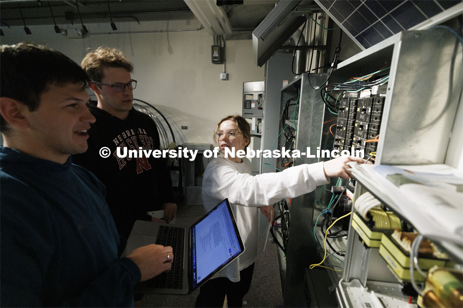Students work out class assignments at the power panels in the PKI lighting lab. College of Engineering photo shoot at Peter Kiewit Institute in Omaha. April 5, 2022. Photo by Craig Chandler / University Communication.