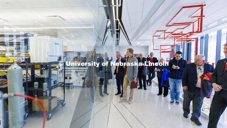 Board of Regents look through the glass walls of one of the labs in the newly built Engineering Research Center during their tour of UNL. College of Engineering. April 7, 2022. Photo by Craig Chandler / University Communication.