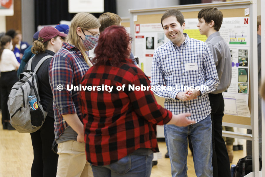 Jonathan Wear answers questions while discussing the geology research. Undergraduate Student Poster Session in the Nebraska Union ballroom as part of Student Research Days. April 11, 2022. Photo by Craig Chandler / University Communication.