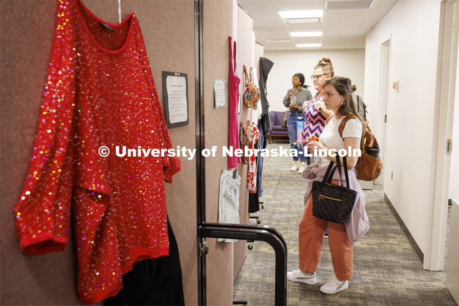 Graduate students Elyxcus Anaya and Jessica Boyles examine the “What Were You Wearing?” survivor art installation in the new CARE space within Neihardt. The display featured recreations of outfits worn by those who were sexually assaulted with accompanying stories from the survivors. It was shown in Neihardt Center as a way for Huskers to see the space CARE will move into during the summer. April 12, 2022. Photo by Craig Chandler / University Communication.